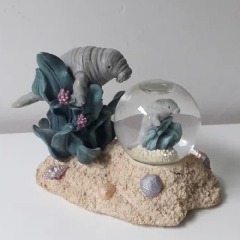 NWT Lamentin Snow Globe Figurine (SeaWorld)